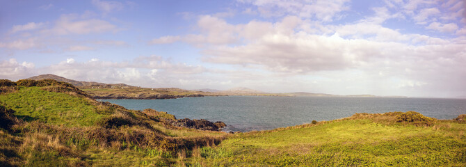 Panoramic landscape with cloudy sky in the southwest of Ireland