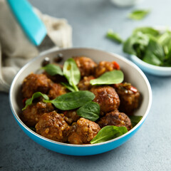 Homemade meatballs with fresh spinach
