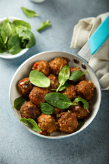 Homemade meatballs with fresh spinach