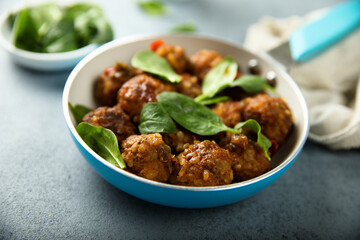 Homemade meatballs with fresh spinach