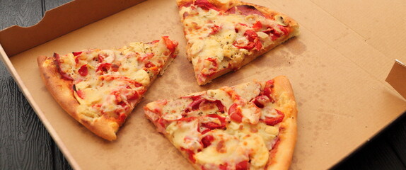 a pizza box with another slice of pizza