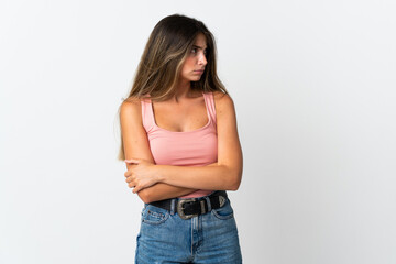 Young caucasian woman isolated on white background keeping the arms crossed
