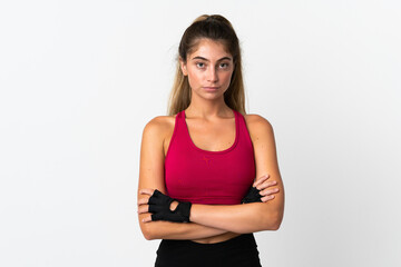 Young caucasian woman isolated on white background with arms crossed