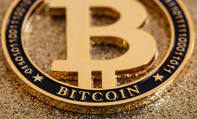 bitcoin on golden background