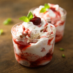 Homemade meringue dessert with raspberry and cream
