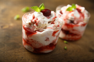 Homemade meringue dessert with raspberry and cream