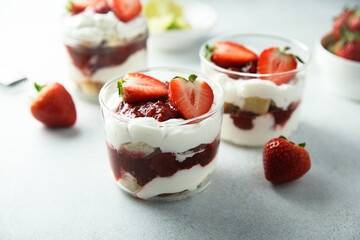 Homemade berry trifle with almond flakes