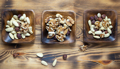 Nuts in a square wooden bowl