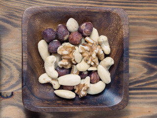 Nuts in a square wooden bowl