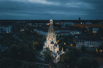 Obraz premium Russian Orthodox Church at Night - Leipzig - Germany Aerial Drone Shot Traditional Religions Architecture Dramatic View