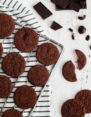 Fresh chocolate cokies on a white wooden background. Top view.
