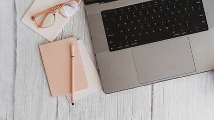 Computer on writer's desk flatlay