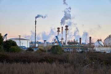 Fototapeta na wymiar Chemical plant expelling gases