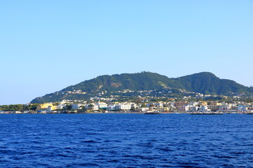Fototapeta na wymiar Ischia port cityscape, harbor with boats