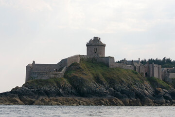 Fototapeta na wymiar Fort La Latte near Saint Cast le Guildo on Brittany coast from the sea or with sunset
