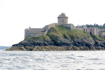 Fototapeta na wymiar Fort La Latte near Saint Cast le Guildo on Brittany coast from the sea or with sunset