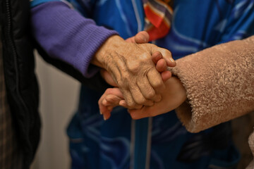 grandmothers holding hands of young men and women. High quality photo