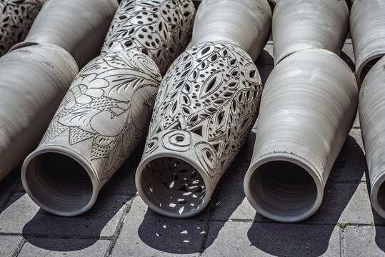 Marginea, Romania - July 13, 2019: Drying vases in front of famous workshop with black ceramics in Marginea village