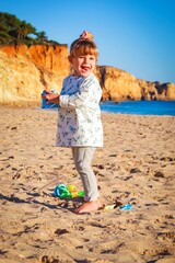 little child on the beach in lagos algarve portugal 
