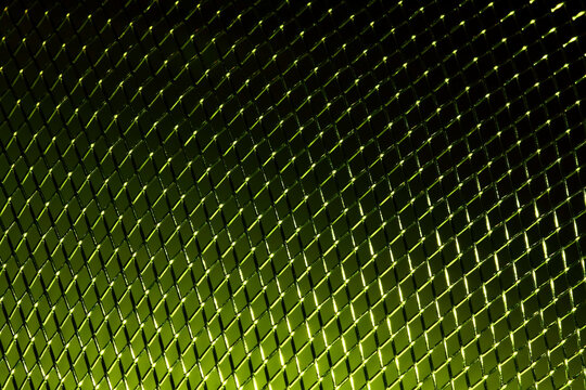 Macro Close Up View Of A Woven Metalic Stainless Steel Green Background