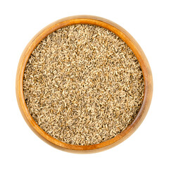 Common chicory seeds, in a wooden bowl. Cichorium intybus, plant of daisy family Asteraceae, with blue flowers. Seeds for growing microgreens, or cultivating salad leaves and chicons (blanched buds). 