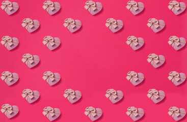 Seamless Pattern of paper hearts on pink background. Top view, flat lay copy space. Love concept.