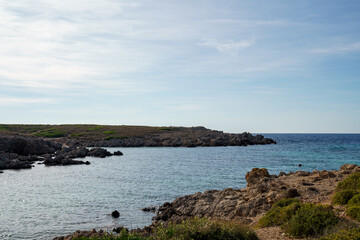Fototapeta na wymiar Cala Turqueta, Menorca. September 2021. Paradise beach on the island of Menorca. Perfect place to relax and enjoy nature in summer.