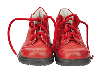 Children's shoes of red color isolated on white background. Old shoes.