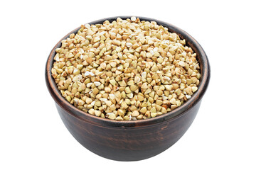 Dry buckwheat in ceramic bowl isolated on white.