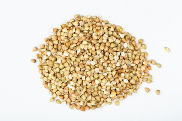 Pile of buckwheat on white background. Buckwheat.