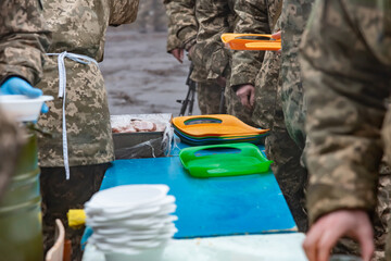 Soldiers at rest dine in the Field Kitchen.