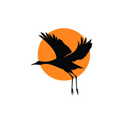 silhouette of flying heron egret crane and sunset logo design