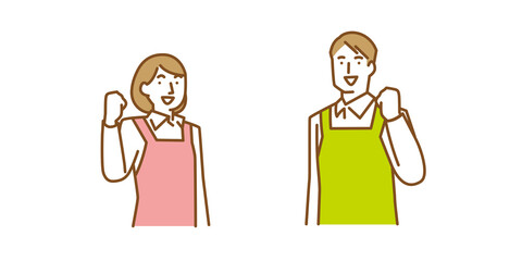 笑顔でガッツポーズをする男性と女性