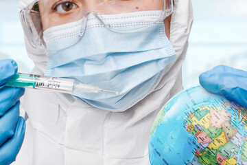 Doctor hand wearing glove injecting syringe of Coronavirus vaccine concept, syringe of vaccine and...