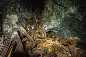 Underground gold mine tunnel with wooden timbering