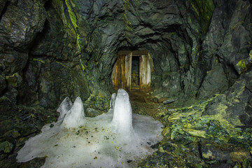 Underground gold mine tunnel with wooden door