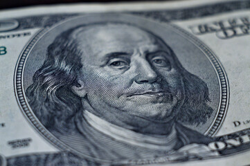 The image of Benjamin Franklin on a bill of one hundred US dollars, a macro shot
 - obrazy, fototapety, plakaty