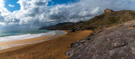 panorama view of empty beaches and mountainous coast in Murcia under an expressive sky