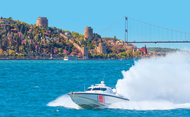 Rumeli Hisari (fortress) in to Bosphorus Sea - Coast Guard patrol boat rushing to the rescue -...