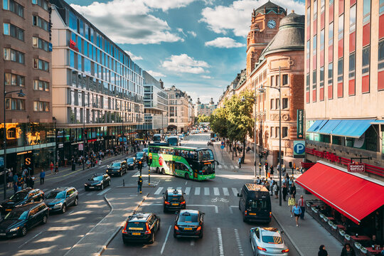 Stockholm, Sweden - June 28, 2019: Red Hop On Hop Off Touristic Bus For Sightseeing Riding Down The Vasagatan Street. City Tour Bus.