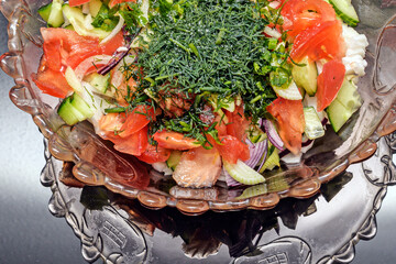 Vegetable salad in a glass bowl close-up