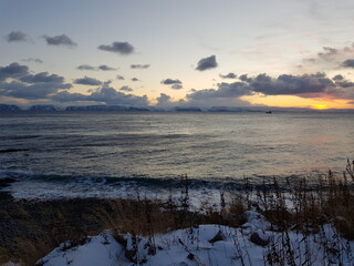 sunset over the cold arctic sea in northern Norway