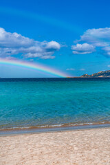 Tavolara Island, scenic view of island and full rainbow in a unique moment