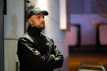 Security Guard Standing In Front Of Building