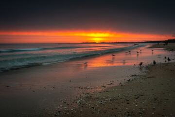 Fototapeta na wymiar Beautiful sunrise on the Baltic Sea beach in Sopot. Poland