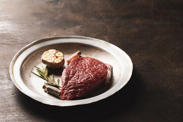 Fresh meat top view. Raw beef steak and spices for cooking.