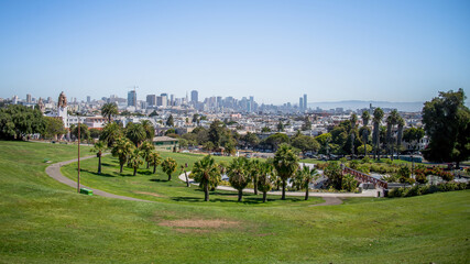 Fototapeta na wymiar San Francisco, California, USA - August 2014: Mission Dolores Park with San Francisco downtown skyline