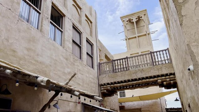Historical Village With Traditional Wind Tower In Al Fahidi Quarter, Old Dubai UAE. Low Angle Handheld