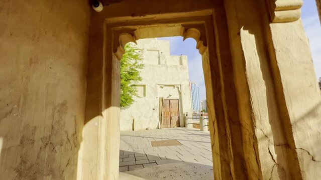 Walking On Empty Alley On Sunny Day In Al Fahidi Neighborhood In Dubai, United Arab Emirates. Dolly Shot