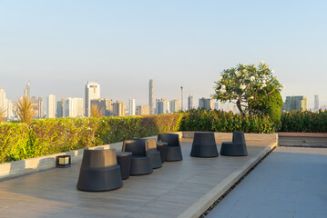 Sky garden on private rooftop of condominium or hotel, high rise architecture building with tree,...